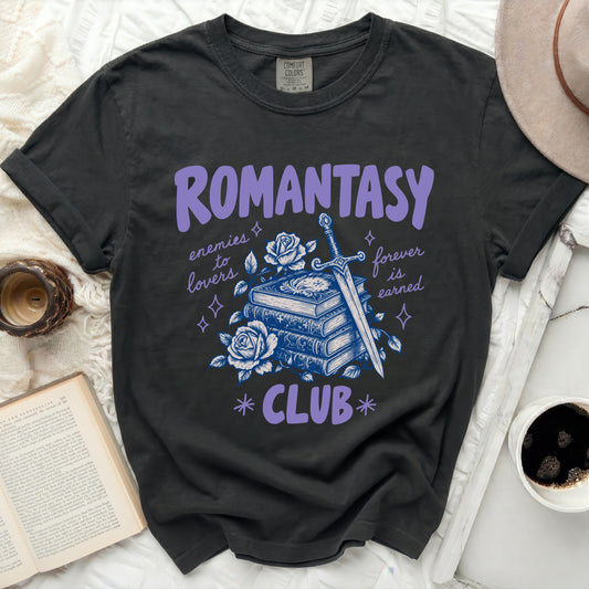 T-shirt with "Romantasy Club" text, sword, books, and roses graphic.