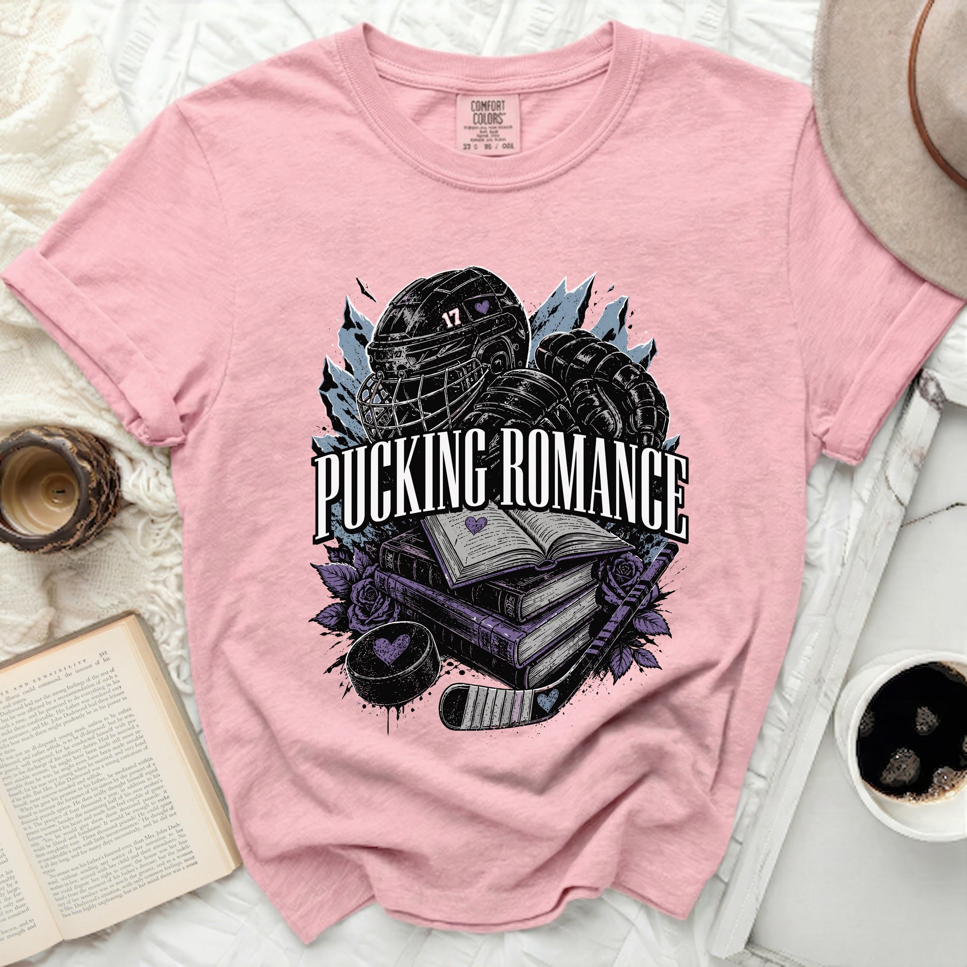 Pink t-shirt with "Pucking Romance" text and hockey graphics.