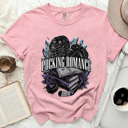 Pink t-shirt with "Pucking Romance" text and hockey graphics.