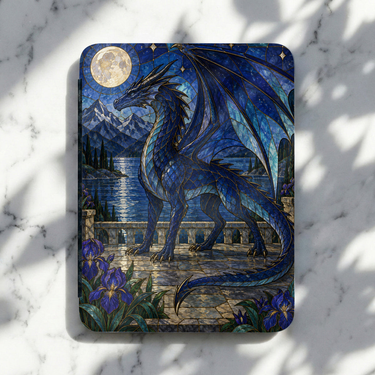 Stained glass dragon overlooking a lake with mountains under a full moon.
