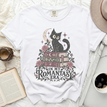 White t-shirt with black cat sitting on books, text reads "In My Romantasy Era".