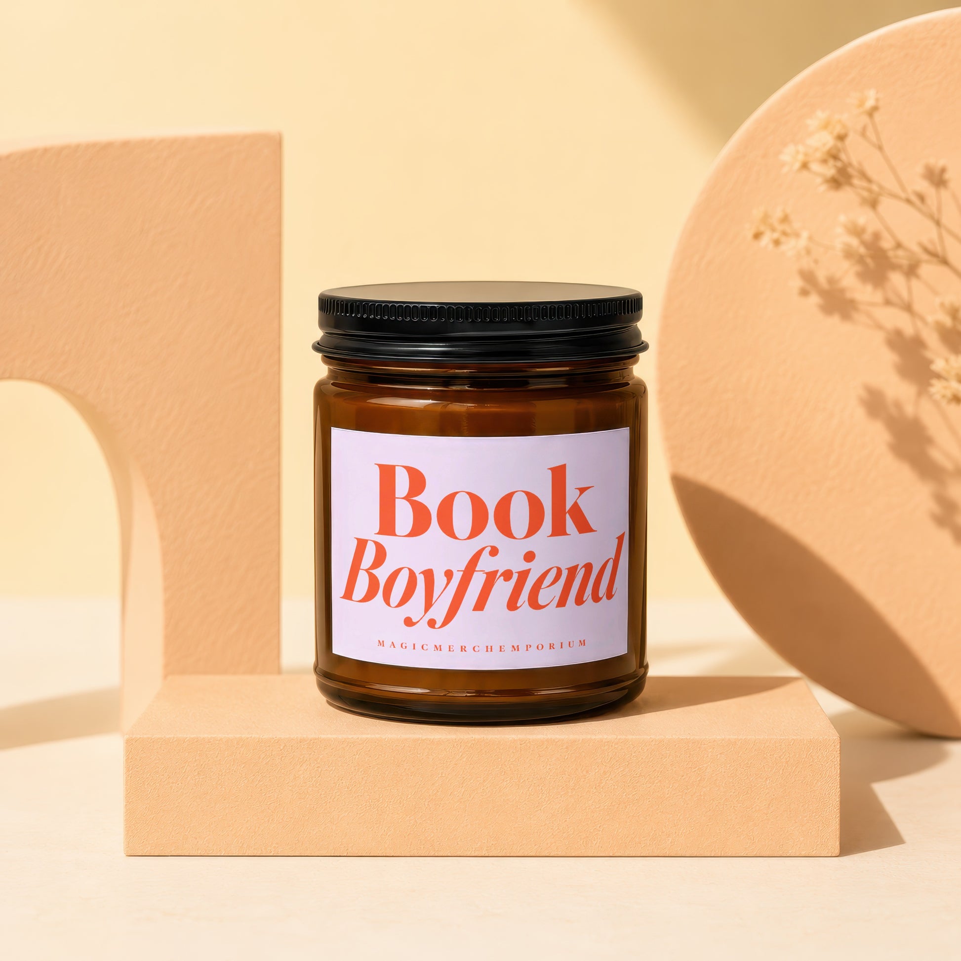 Amber glass candle with "Book Boyfriend" and "MAGICMERCH™ EMPORIUM" text.