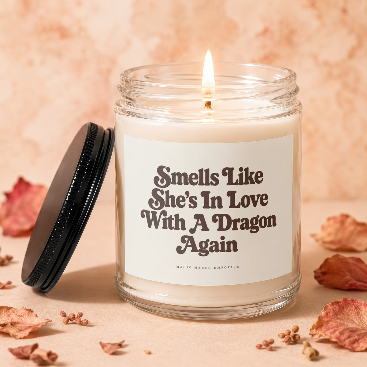 Candle with text "Smells Like She's In Love With A Dragon Again"
