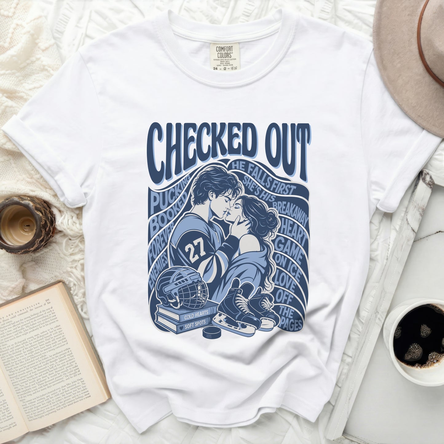 White t-shirt with "CHECKED OUT" and hockey graphics.