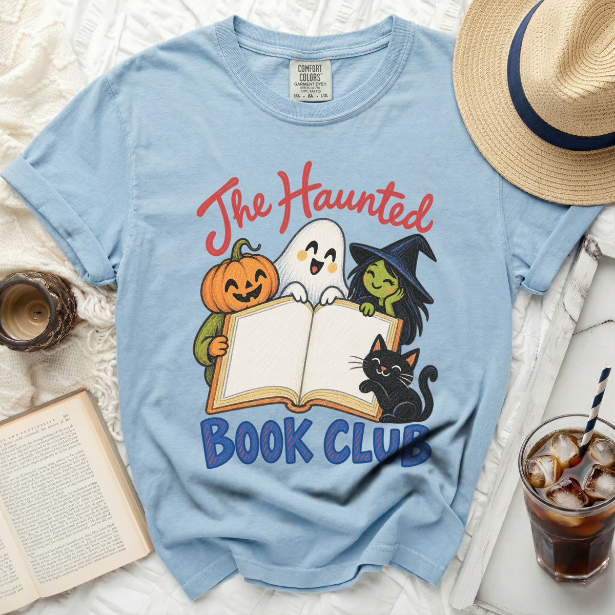 Light blue t-shirt with "The Haunted Book Club" text and Halloween characters.
