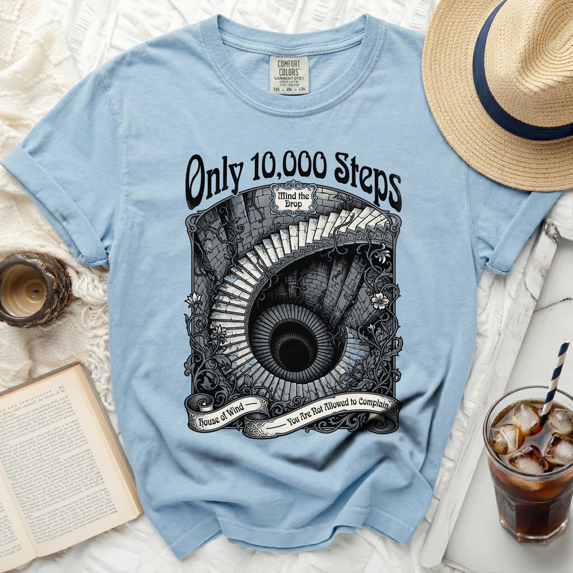 Light blue t-shirt with "Only 10,000 Steps" and spiral staircase graphic.