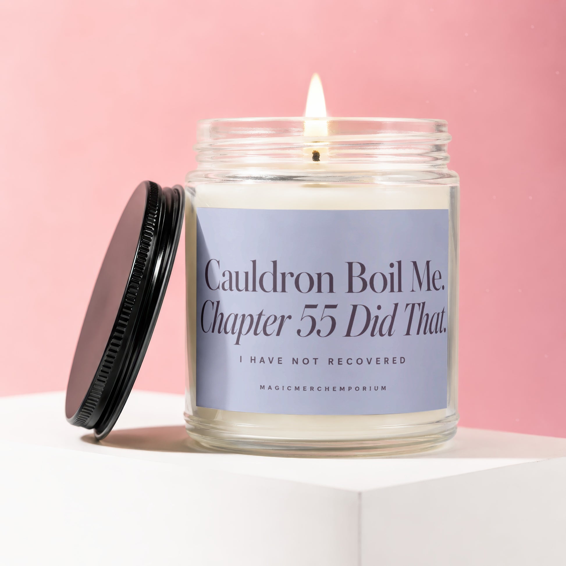 Candle with "Cauldron Boil Me. Chapter 55 Did That." text on label.