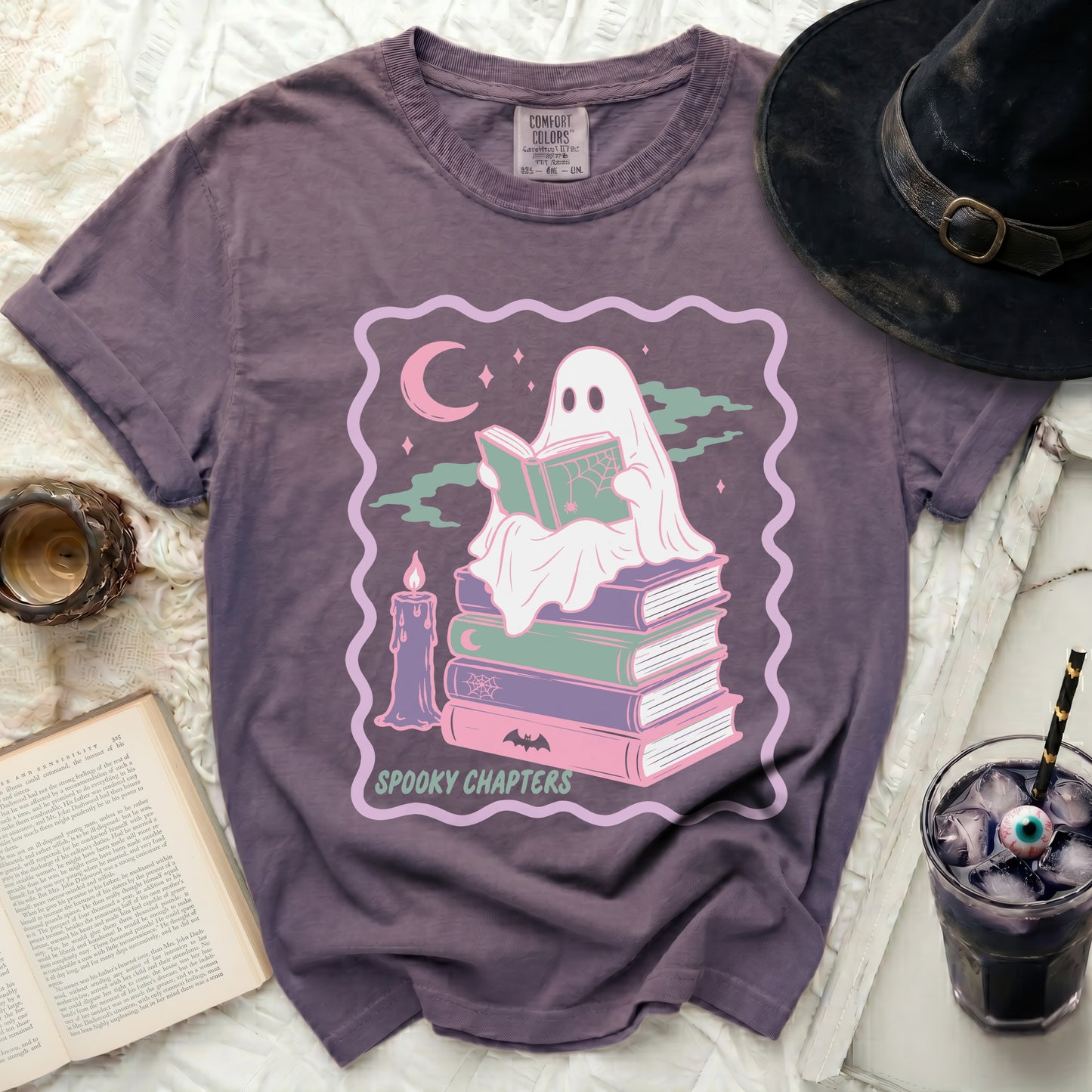 Ghost reading book on stack of books with text Spooky Chapters.