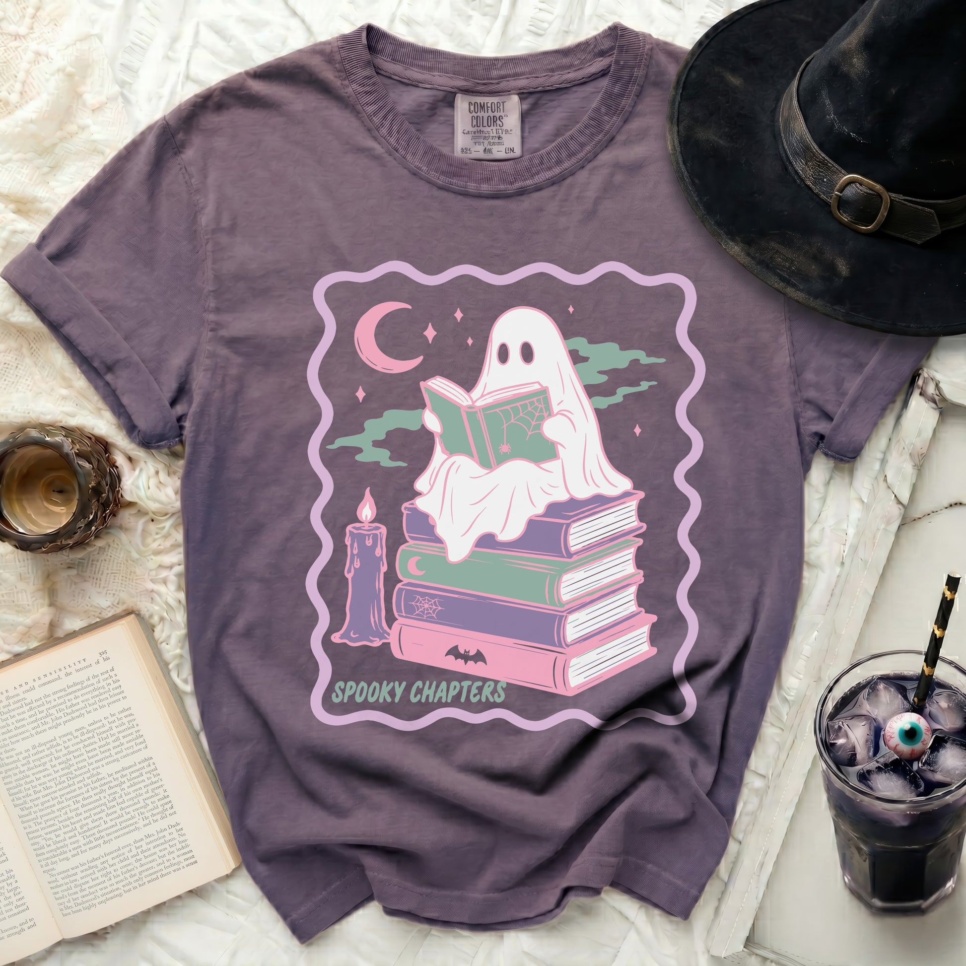 Ghost reading book on stack of books with text Spooky Chapters.