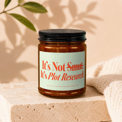 Amber jar candle with "It's Not Smut. It's Plot Research" text and "MAGIC MERCH EMPORIUM"