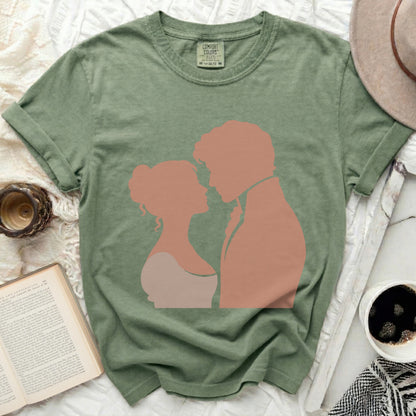 Green Comfort Colors t-shirt with silhouette of embracing couple.