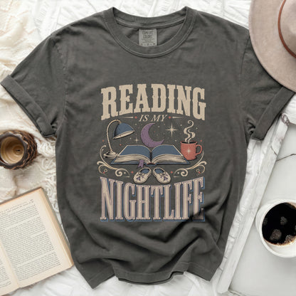 Reading is my nightlife graphic t-shirt with book, lamp, and moon design.