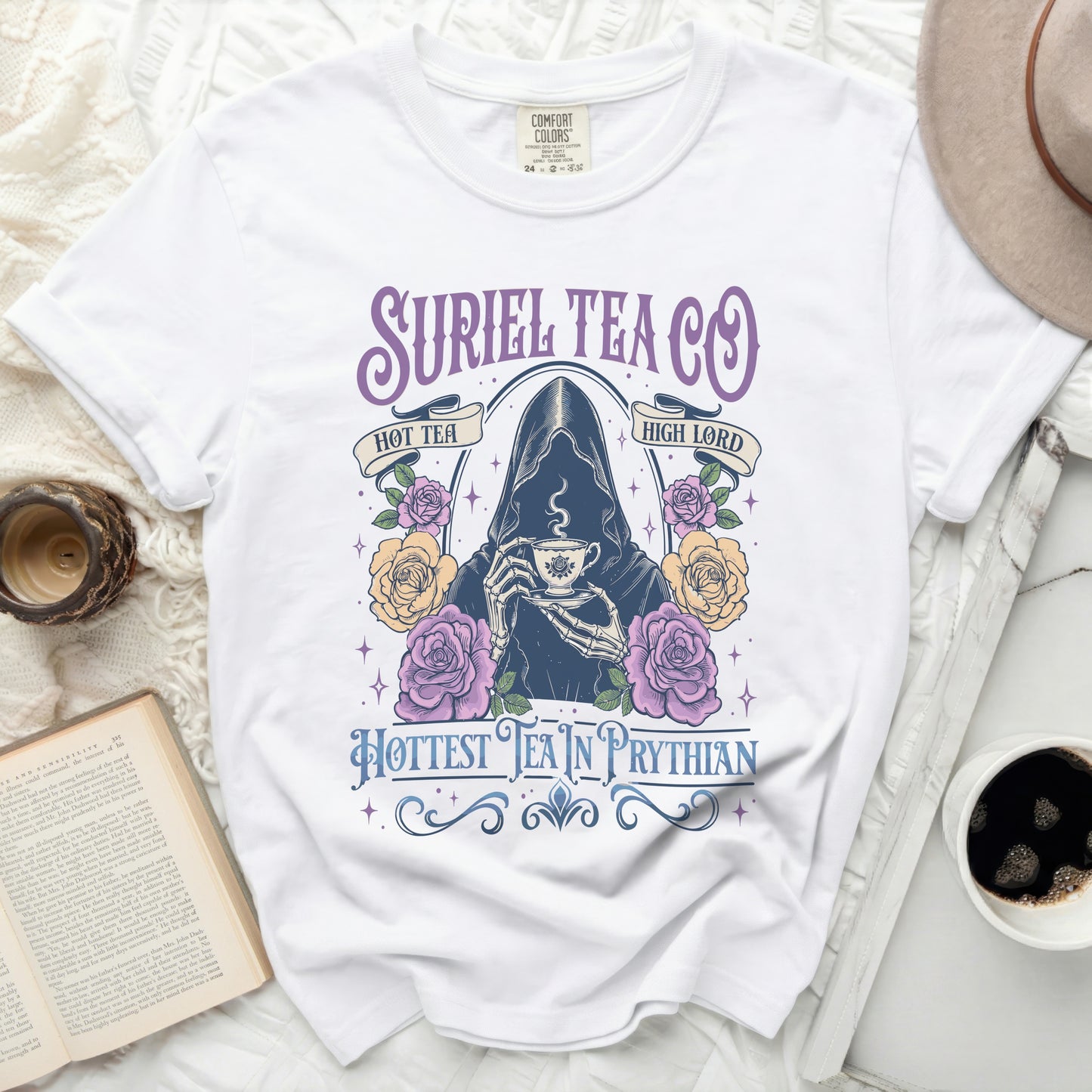 White t-shirt with "Suriel Tea Co" and a skeleton holding a teacup.