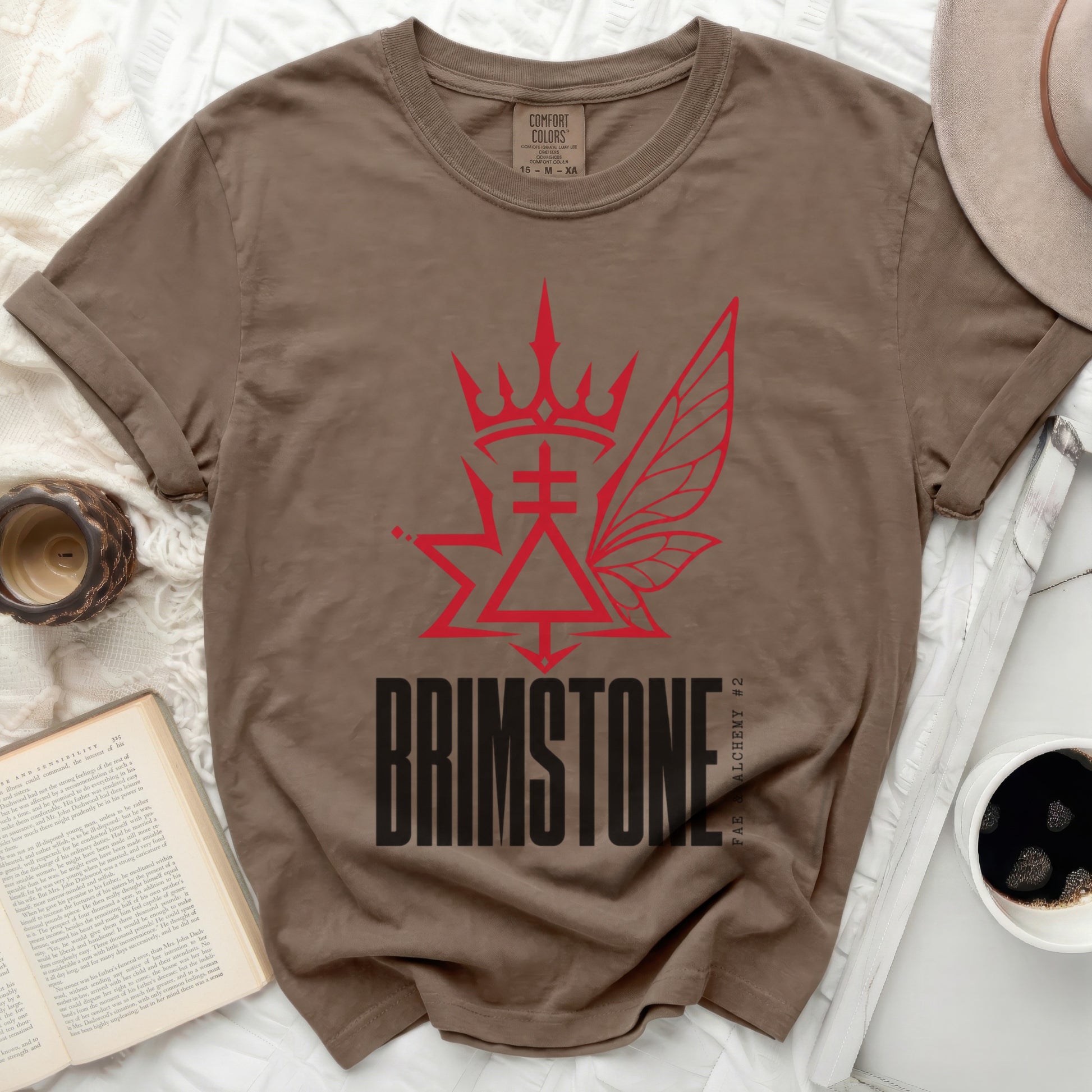Brown t-shirt with red "BRIMSTONE FAE & ALCHEMY #2" graphic.