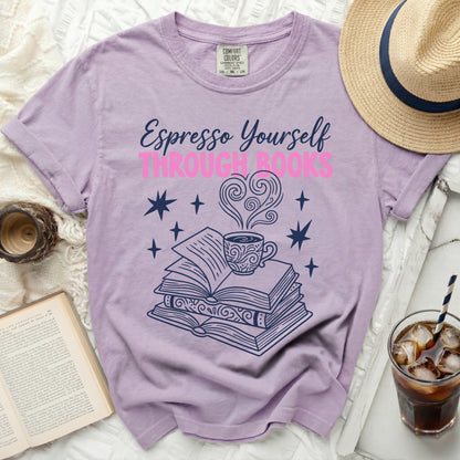 Purple t-shirt with "Espresso Yourself Through Books" text and book graphic.
