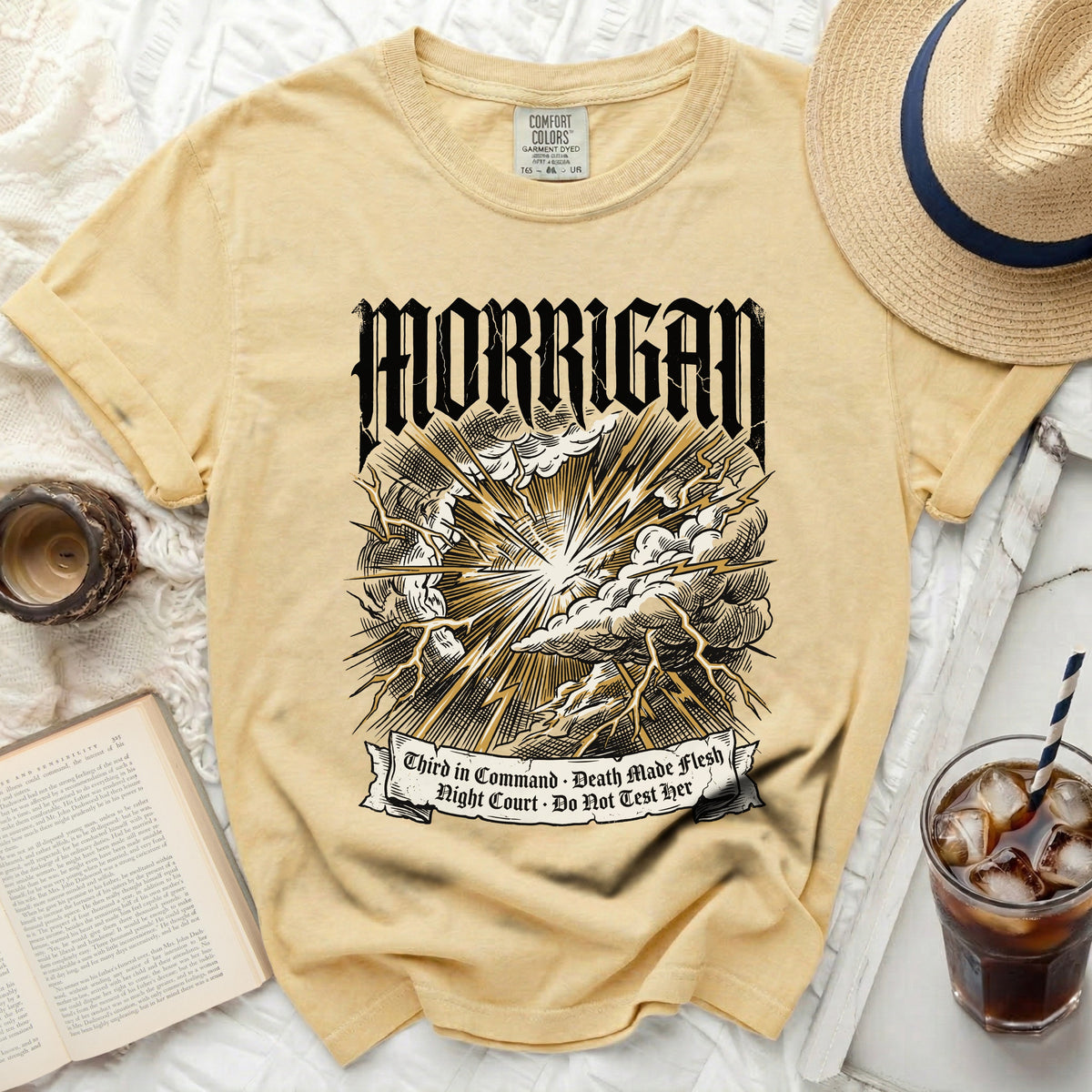 Yellow Comfort Colors t-shirt with "MORRIGAN" and lightning graphic.
