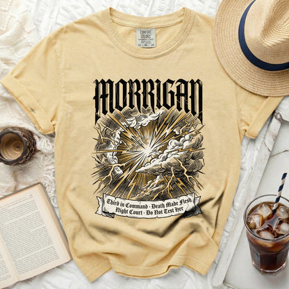 Yellow Comfort Colors t-shirt with "MORRIGAN" and lightning graphic.