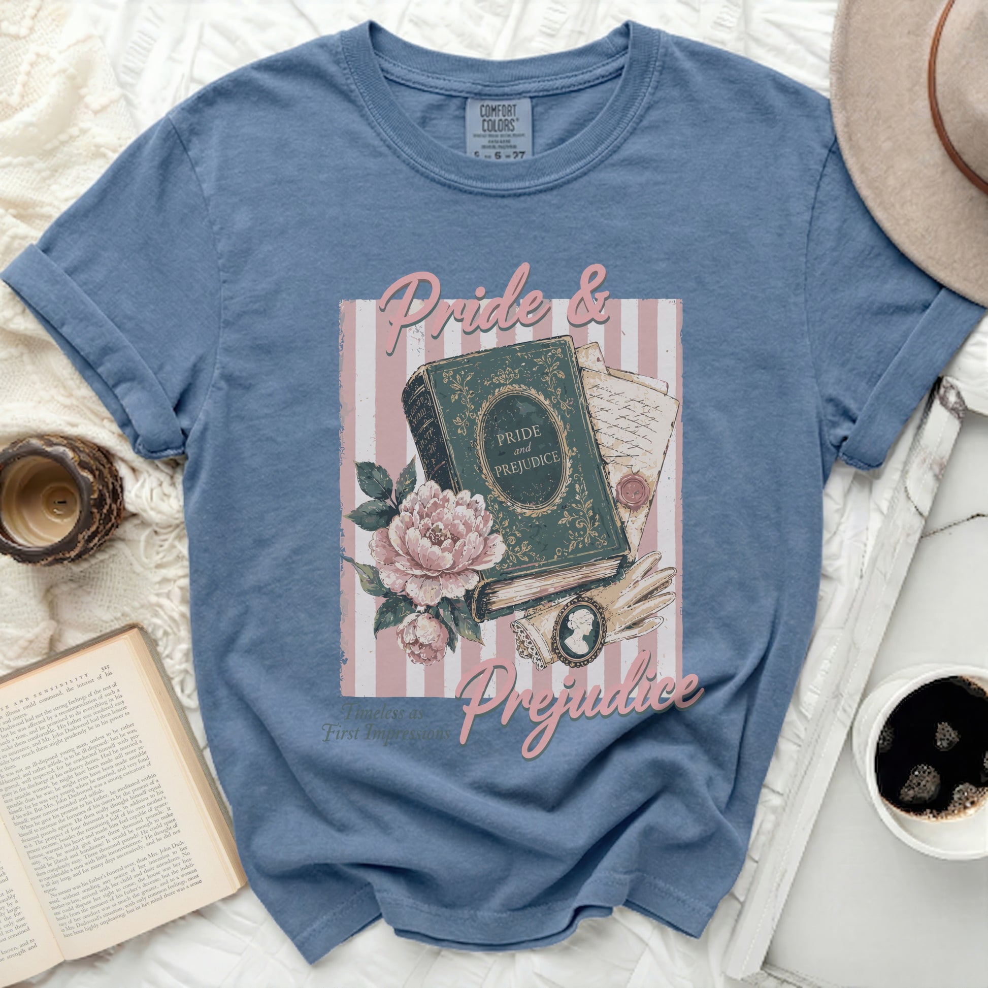 Comfort Colors blue t-shirt with Pride and Prejudice book and floral graphic.