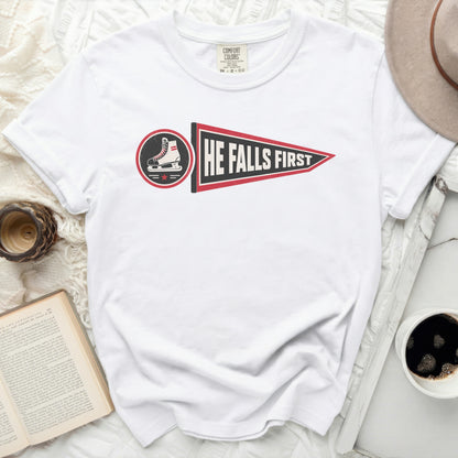 White Comfort Colors t-shirt with "HE FALLS FIRST" pennant graphic.
