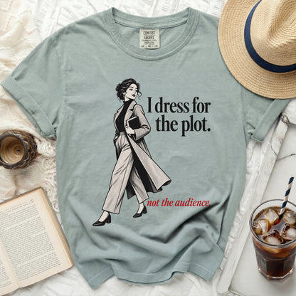 T-shirt with graphic of a woman and text "I dress for the plot. not the audience."