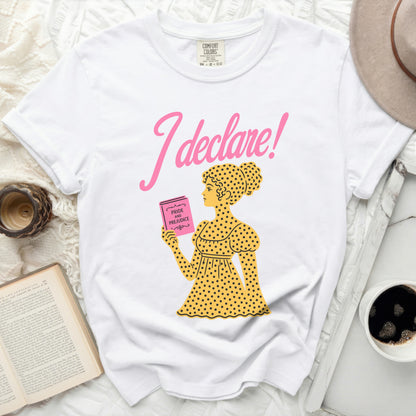 White t-shirt with pink "I declare!" and illustration of woman reading Pride and Prejudice.