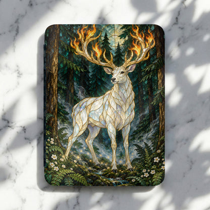 Stained glass white stag with flaming antlers in a mystical forest.