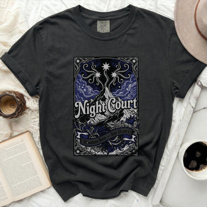 Dark t-shirt with "Night Court Mountain Born Star Eternal" text and celestial design.