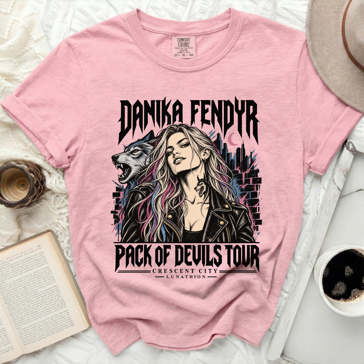 Pink t-shirt with "Danika Fendyr Pack of Devils Tour" graphic.