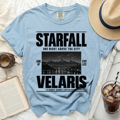 Light blue t-shirt with "STARFALL VELARIS" graphic and city skyline.