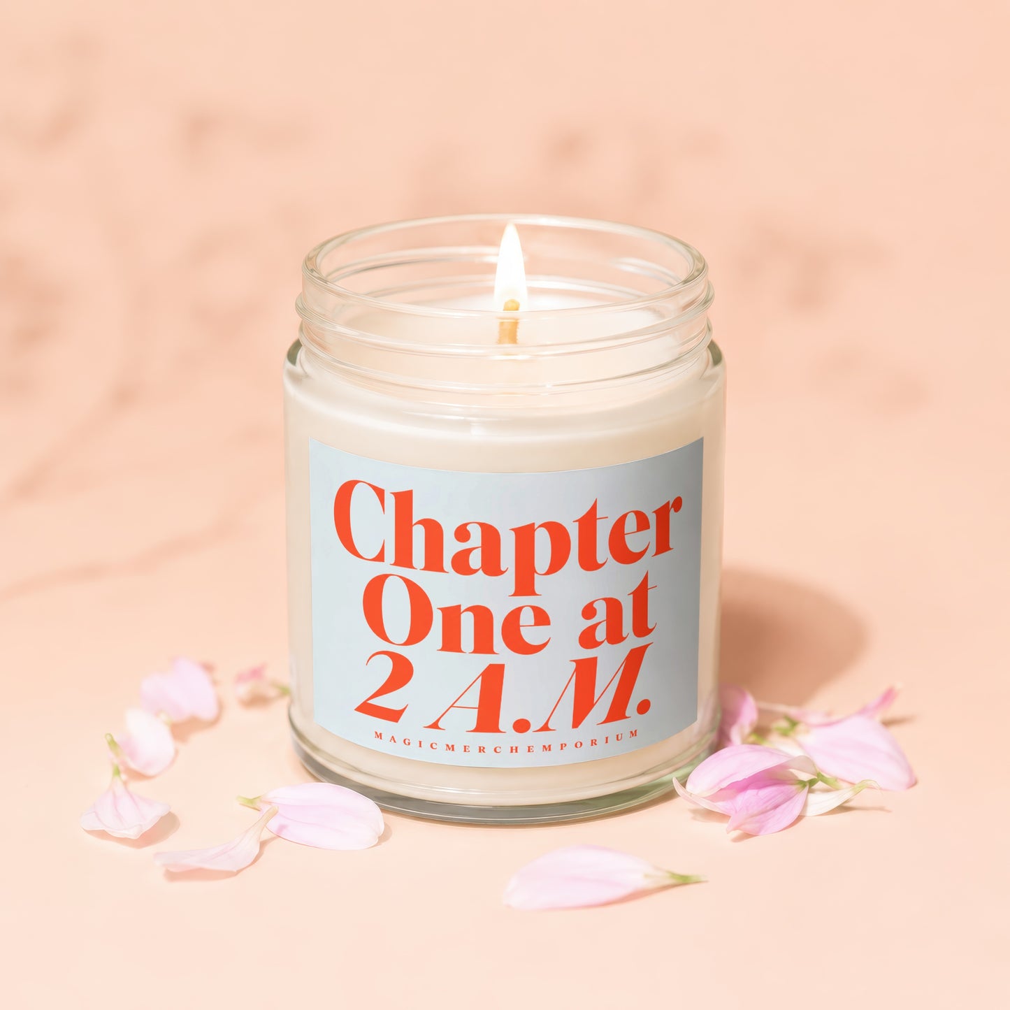 Candle with "Chapter One at 2 A.M." text and scattered pink petals.