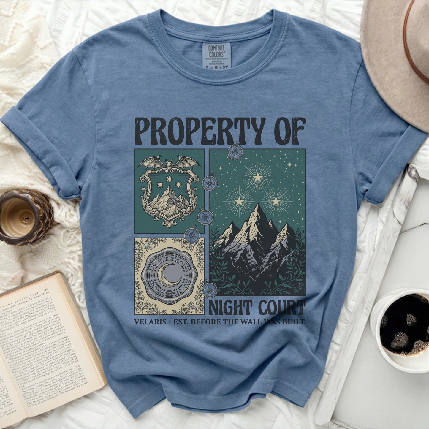 Blue t-shirt with "PROPERTY OF NIGHT COURT" and a crest with a bat, mountains, and moon.
