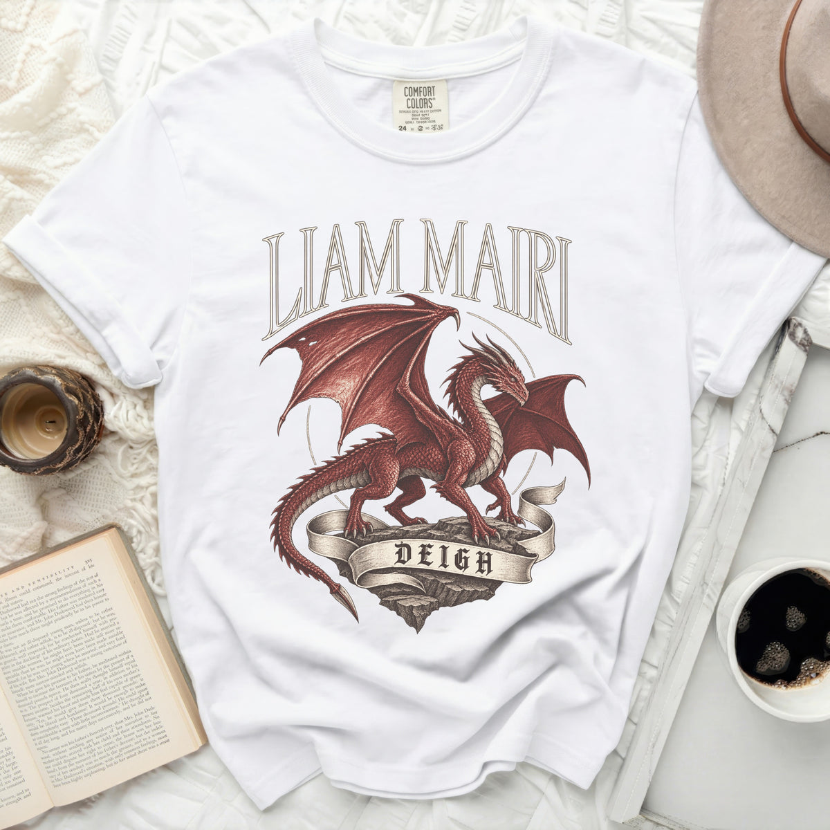 White t-shirt with red dragon design and text "LIAM MAIRI DEIGH".
