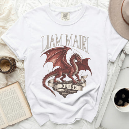 White t-shirt with red dragon design and text "LIAM MAIRI DEIGH".