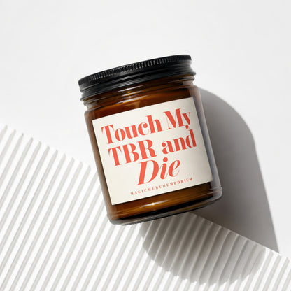 Brown glass candle with "Touch My TBR and Die" text on the label.