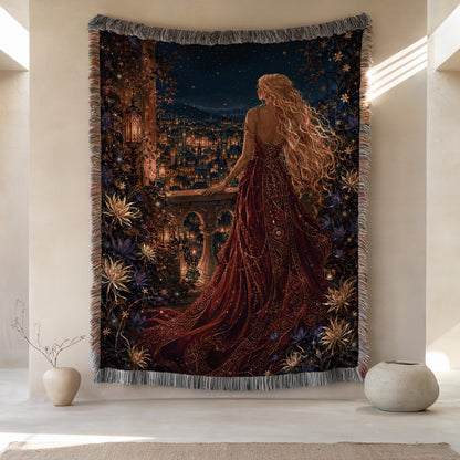 a large tapestry hanging on a wall, depicting a woman in a long red dress standing in front of a cityscape at night. The tapestry is adorned with flowers and other decorative elements, creating a visually striking and artistic scene.