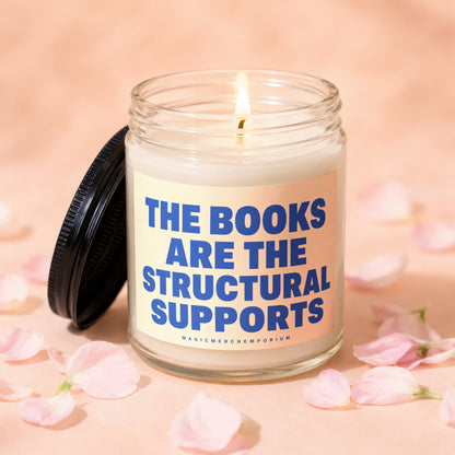 Lit candle with blue text "The Books Are The Structural Supports".