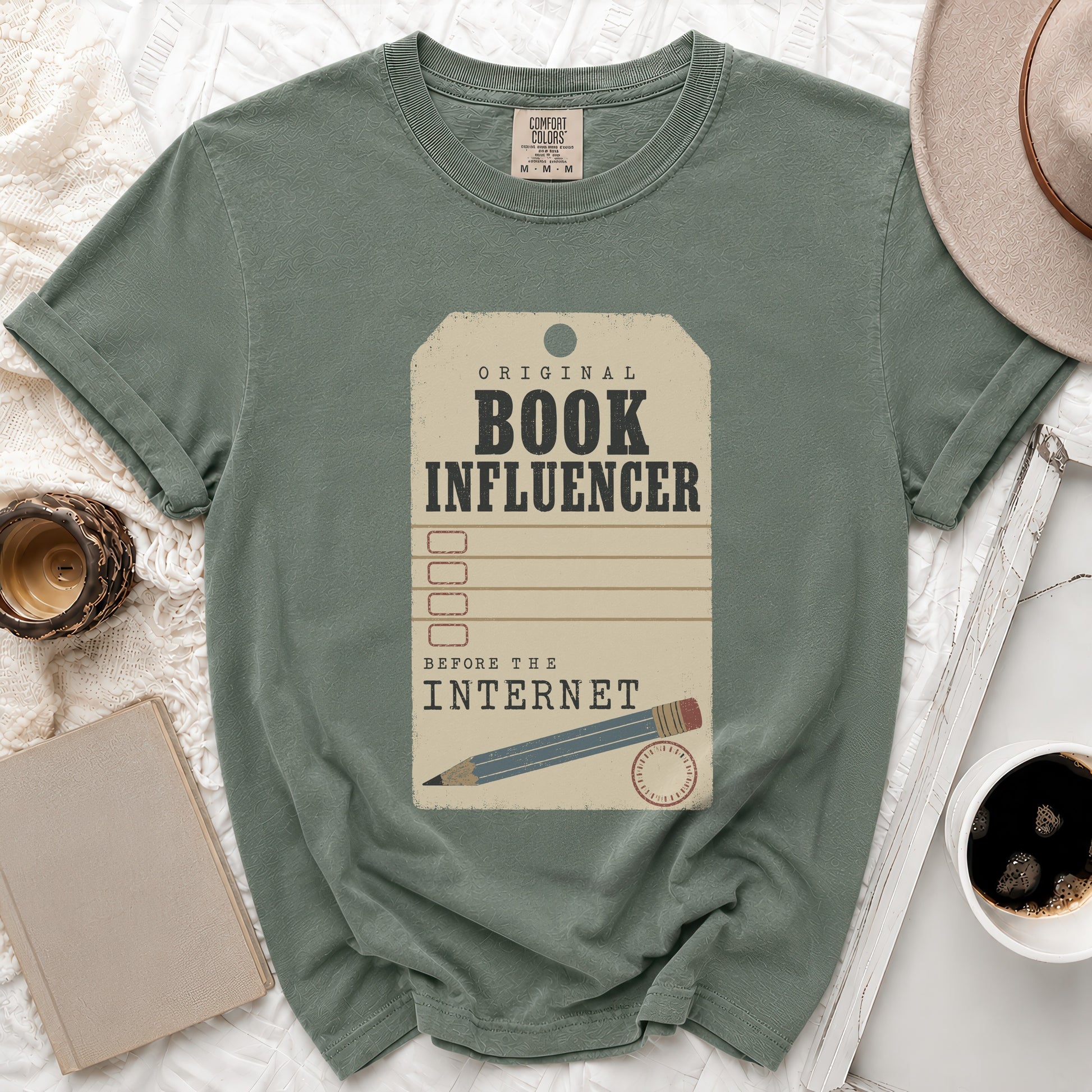 Green t-shirt with "Original Book Influencer Before the Internet" text graphic.