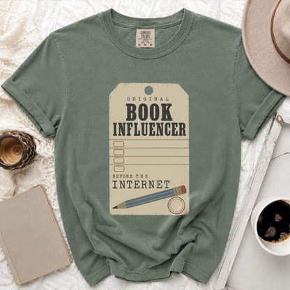 Green t-shirt with "Original Book Influencer Before the Internet" text graphic.