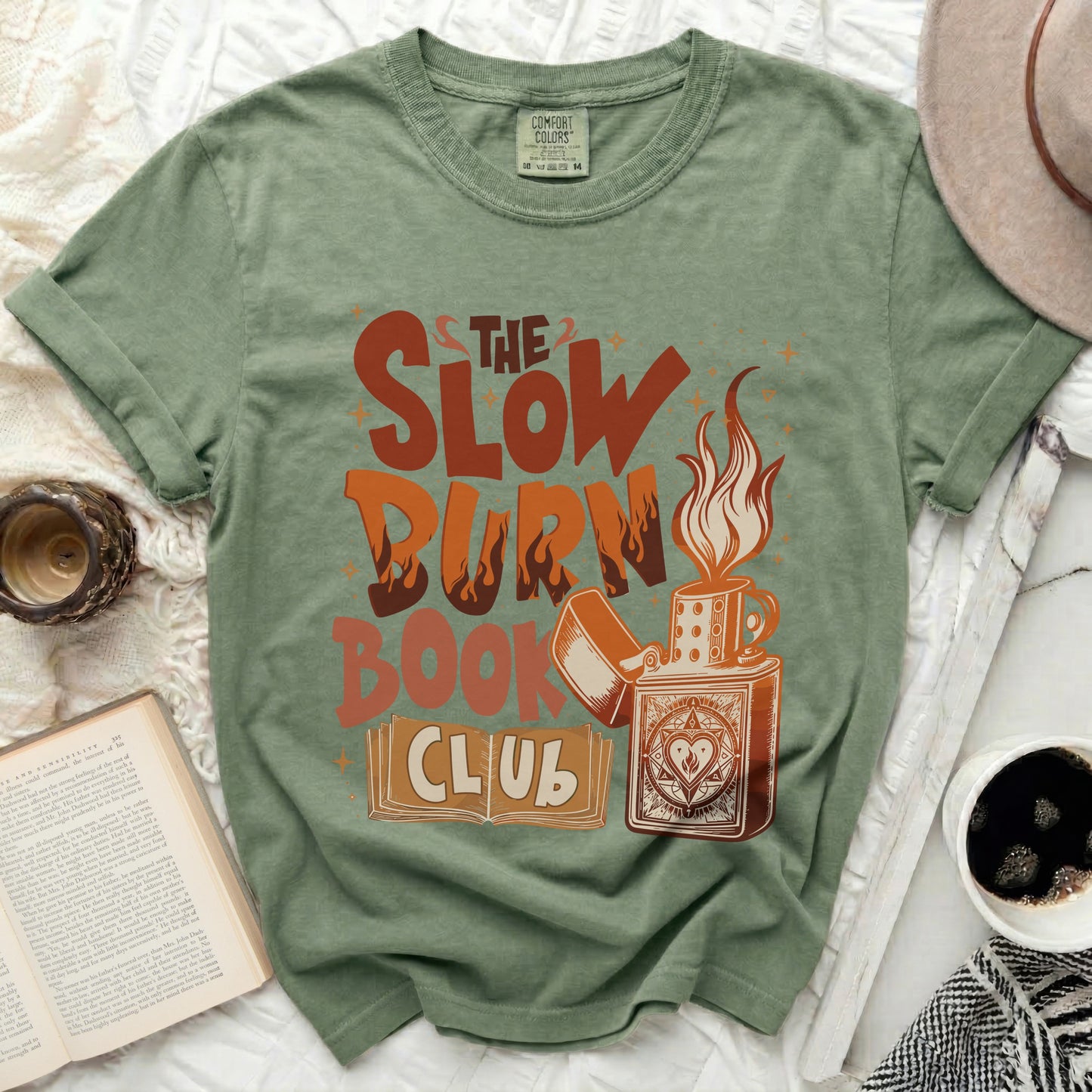 Green t-shirt with "The Slow Burn Book Club" graphic and a lighter.
