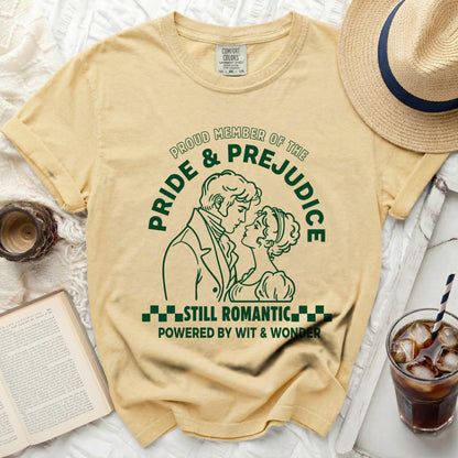 Yellow t-shirt with green "Pride & Prejudice" graphic and romantic couple illustration.