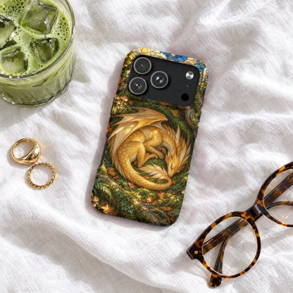 Phone case featuring a golden dragon resting in a forest, surrounded by glasses, rings, and iced matcha.