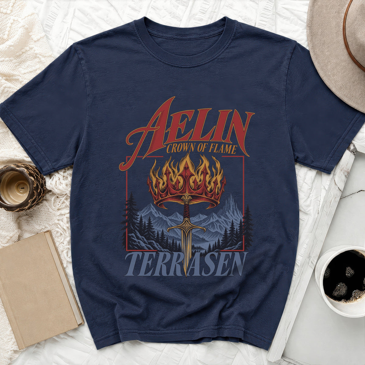 Dark blue t-shirt with "Aelin Crown of Flame Terrasen" text and crown graphic.