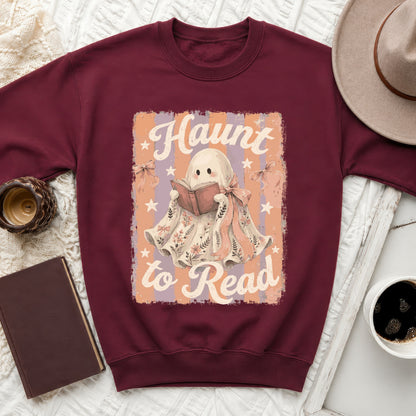 Maroon sweatshirt with "Haunt to Read" text and cute ghost graphic.