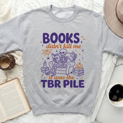 Skeleton reading a book with text "BOOKS didn't kill me it was the TBR PILE"