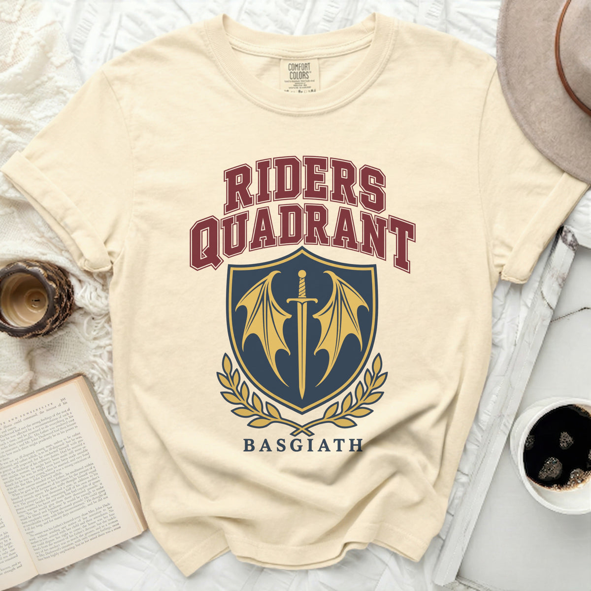 Cream t-shirt with "RIDERS QUADRANT BASGIATH" and a shield logo.