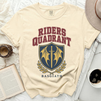 Cream t-shirt with "RIDERS QUADRANT BASGIATH" and a shield logo.