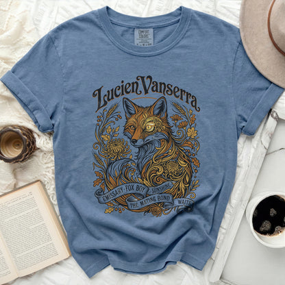 Blue t-shirt with intricate fox and floral design, "Lucien Vanserra" text.