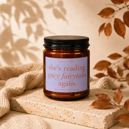Candle with label "smells like she's reading spicy fairytales again."