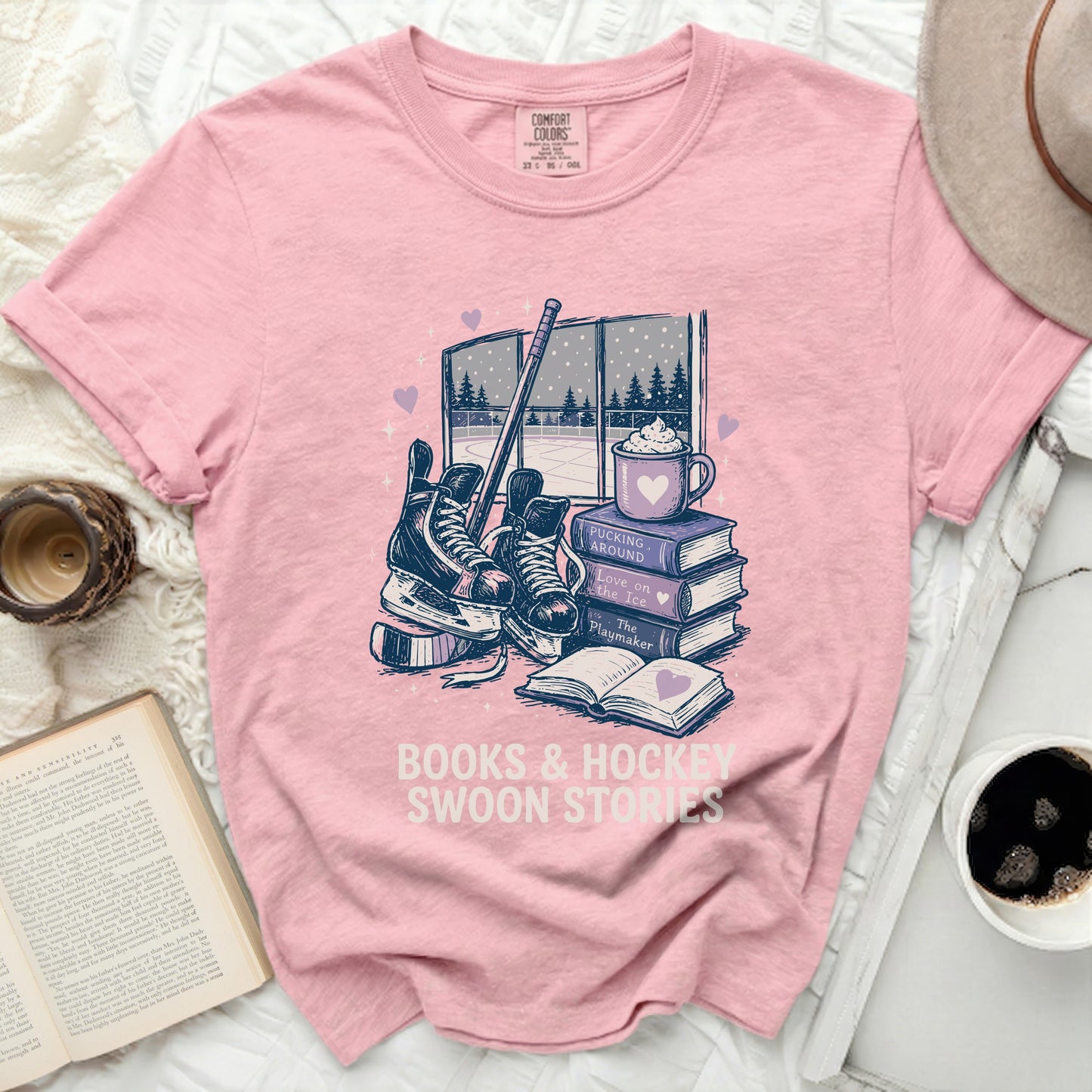 Pink t-shirt with books, hockey gear, and "Books & Hockey Swoon Stories" text.