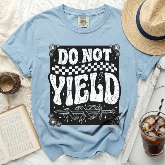 Light blue t-shirt with "DO NOT YIELD" and a sword design.